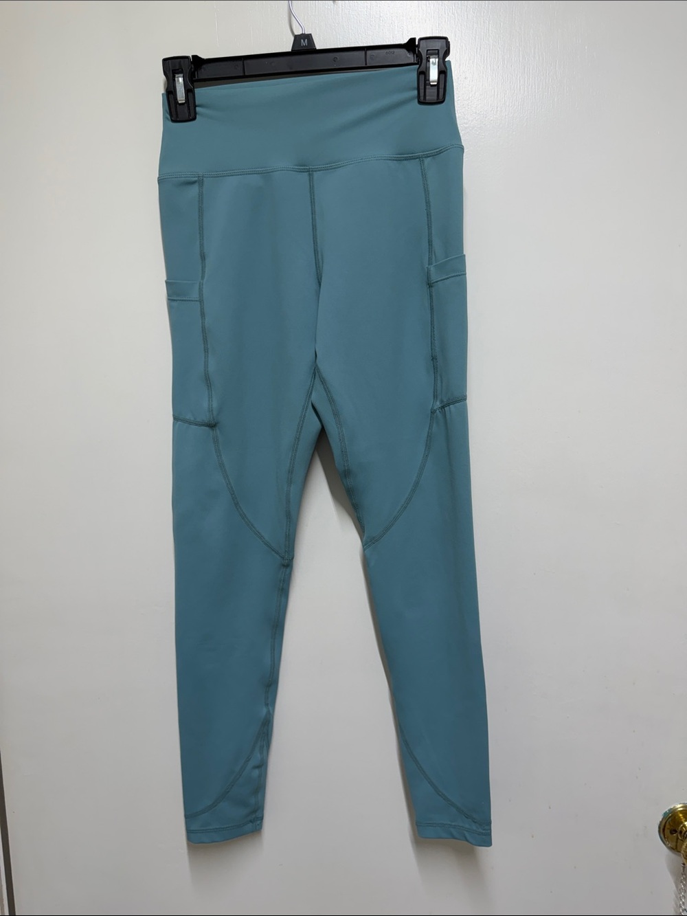 Women’s High-Waist Performance Leggings in Teal and pockets.